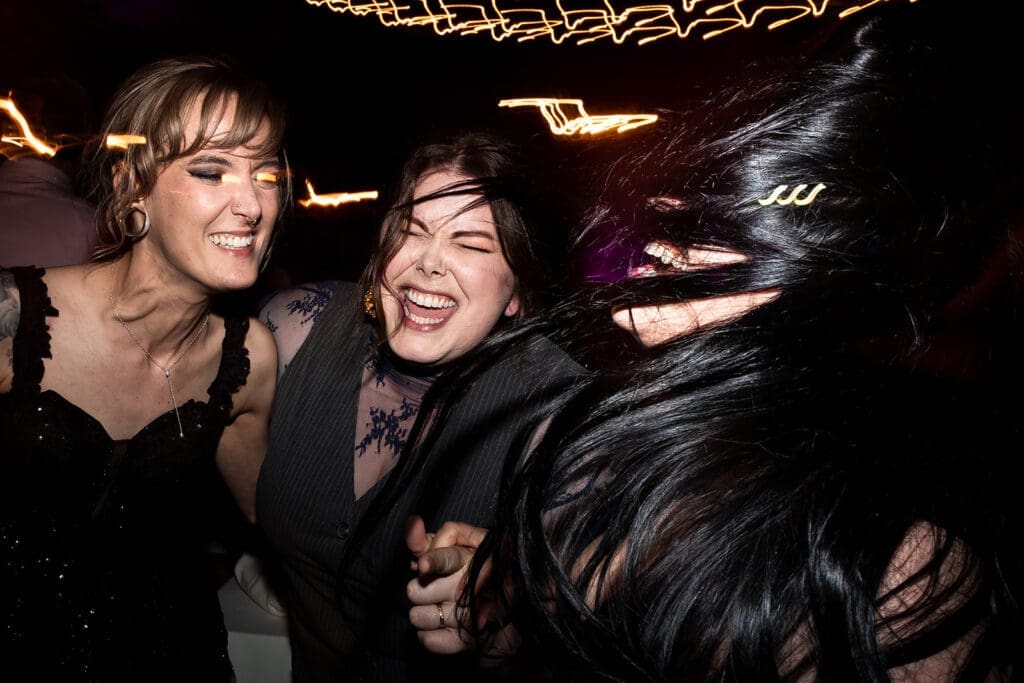 Guests dancing at barn reception at Olympias Valley Estate wedding