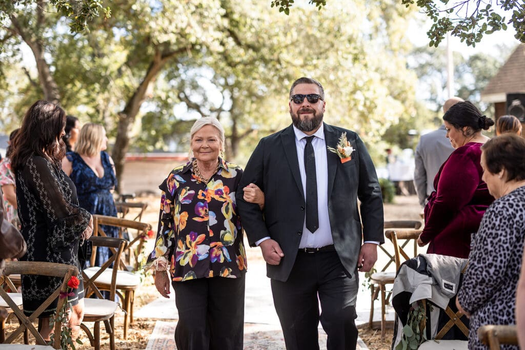 Groom walks down the aisle at Sonoma County backyard wedding.