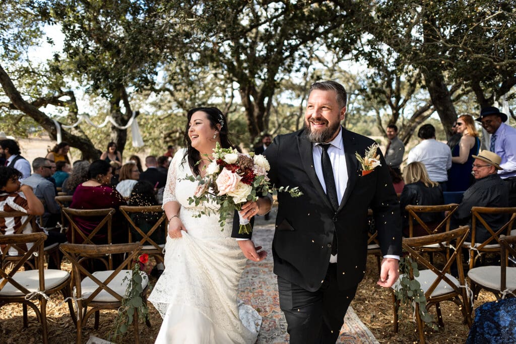 Couple exits their ceremony at this Sonoma County backyard wedding.
