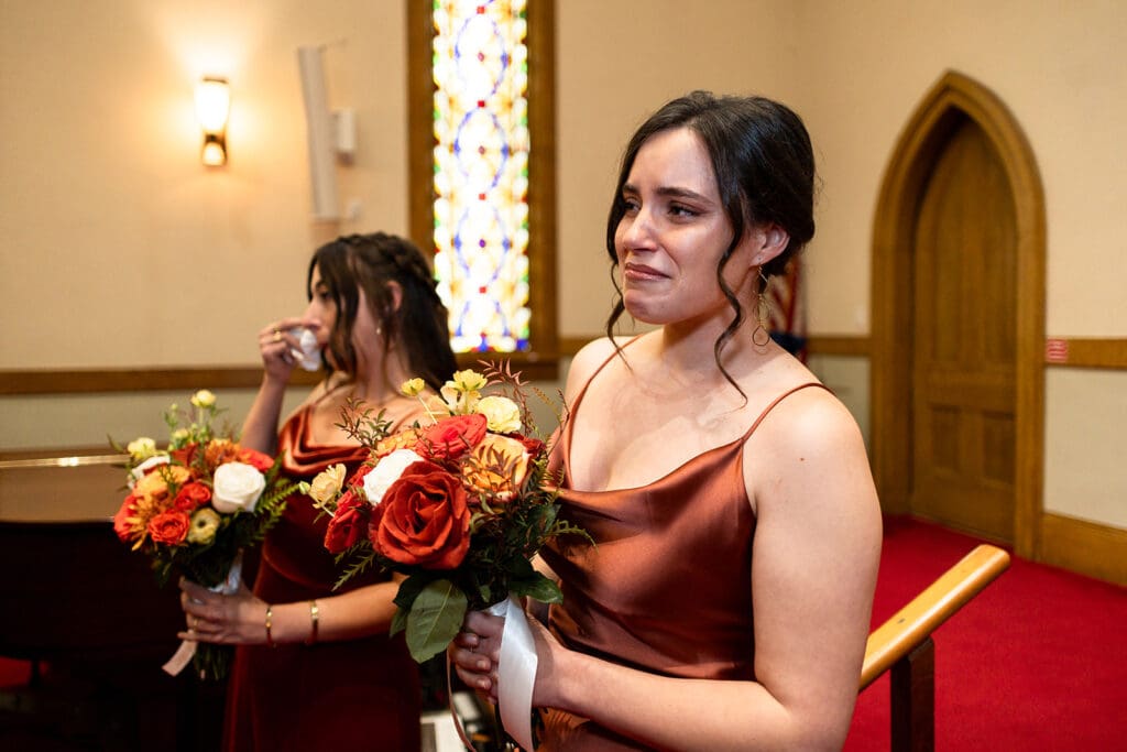 Bridesmaid tears up as bride walks down aisle at Elim Church Ceremony, Petaluma. 