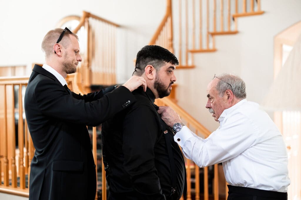 groom and groomsmen getting ready at home for his intimate petaluma wedding.