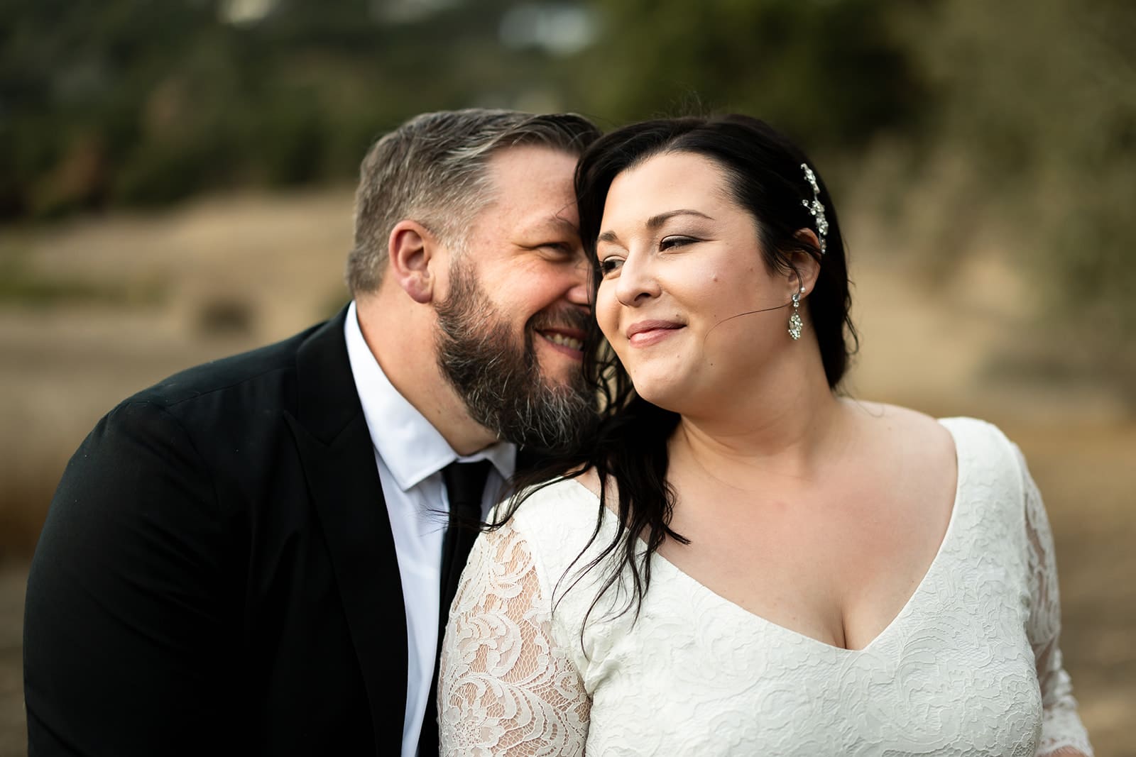 Sonoma County backyard wedding couple smiles for portraits