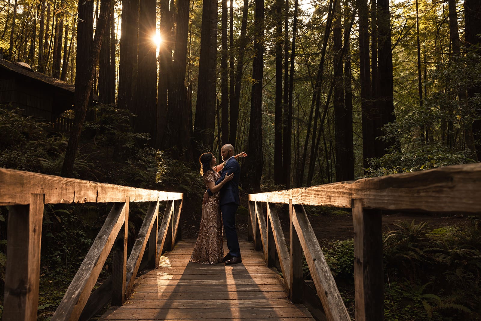 Couple embraces at their Mendocino Woodlands Wedding among the redwoods.