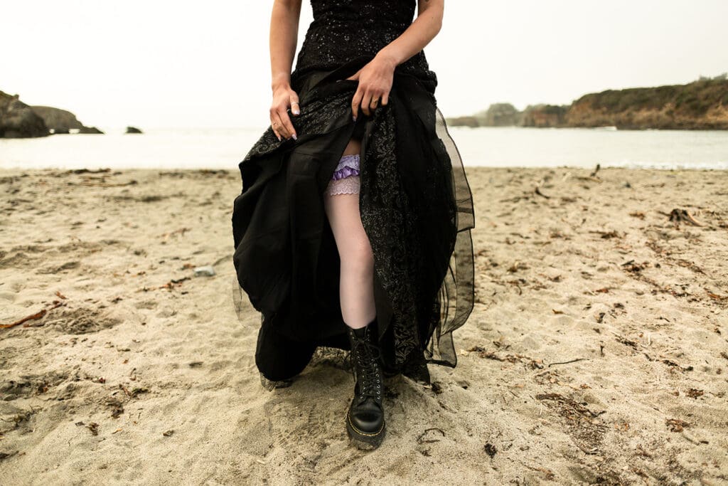 Bride wearing Doc Martens boots with sparkly black gown at Mendocino wedding