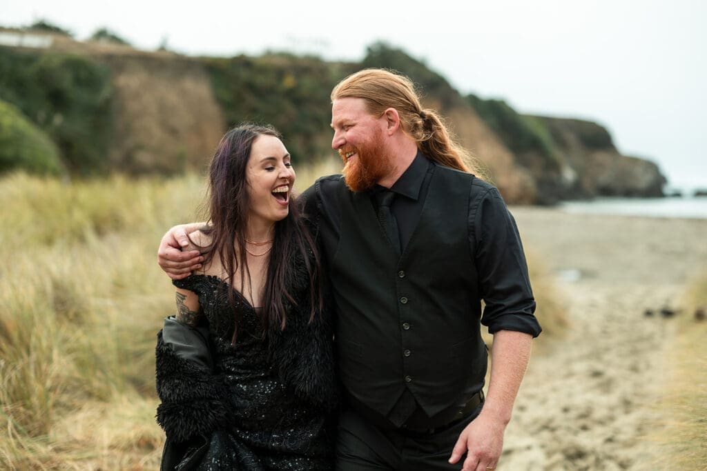 Bride and groom sharing a private moment on the Mendocino beach after their wedding ceremony