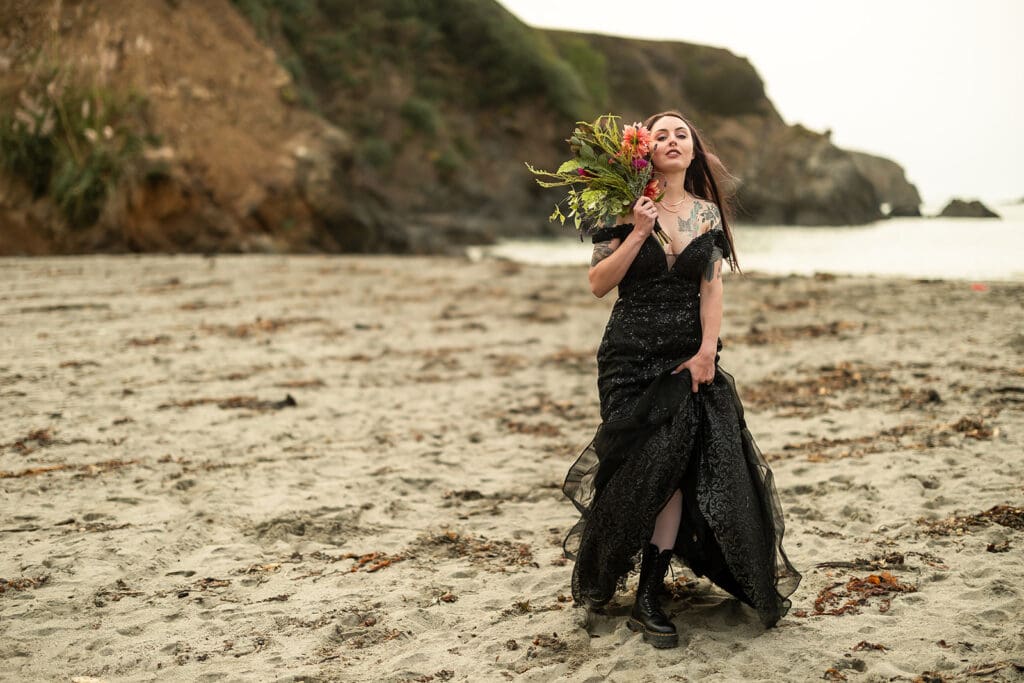 Bride in sparkly black wedding dress for non-traditional Mendocino wedding