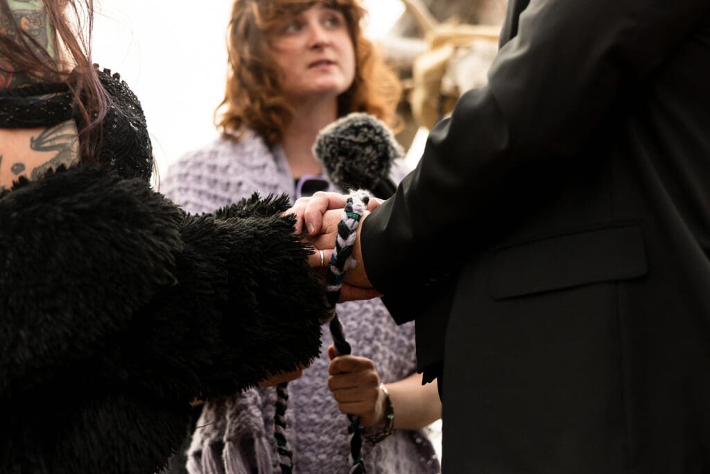 Bride and groom knot tying ceremony at witchy Mendocino Coast wedding