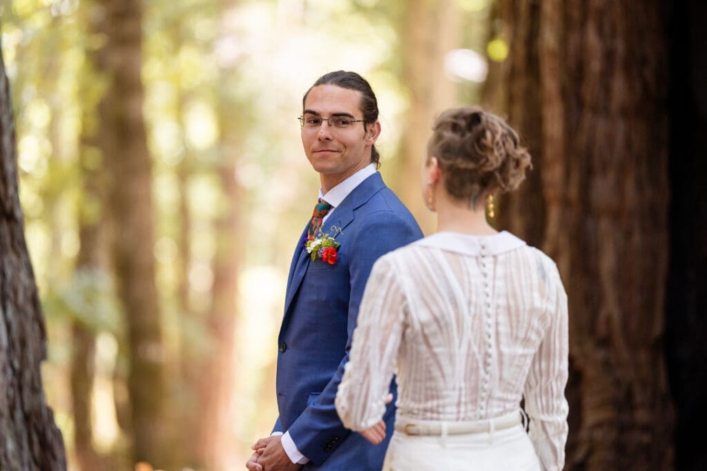 Couple sharing a first look inside a fairy ring of redwoods at Leonard Lake Reserve