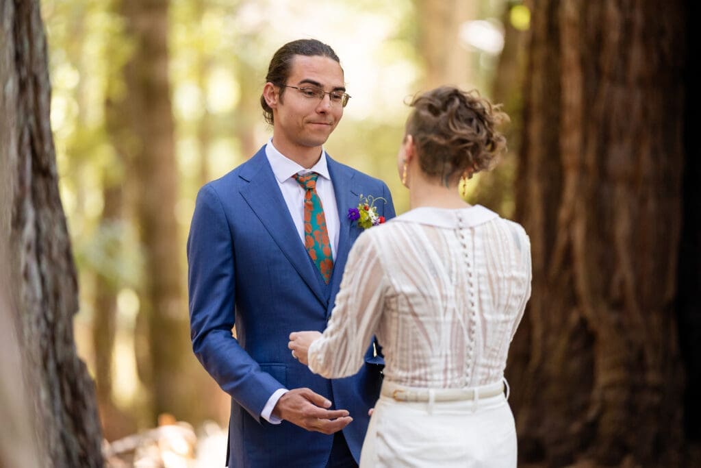 Couple sharing a first look inside a fairy ring of redwoods at Leonard Lake Reserve