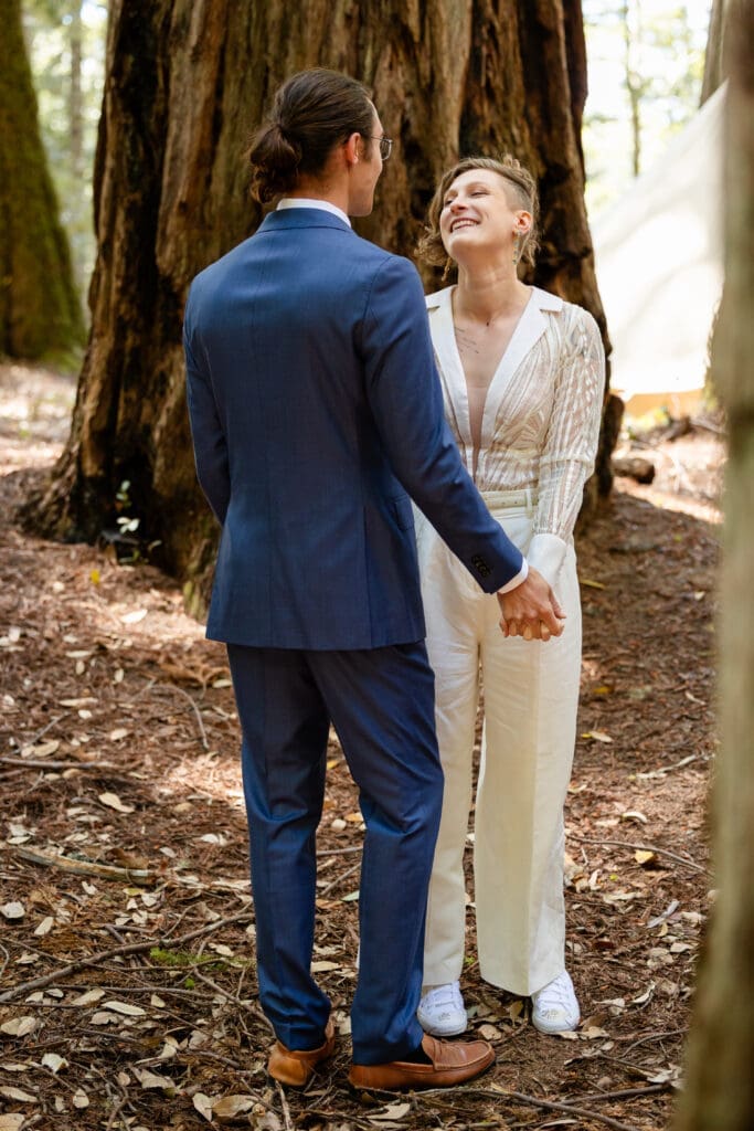 Couple sharing a first look inside a fairy ring of redwoods at Leonard Lake Reserve