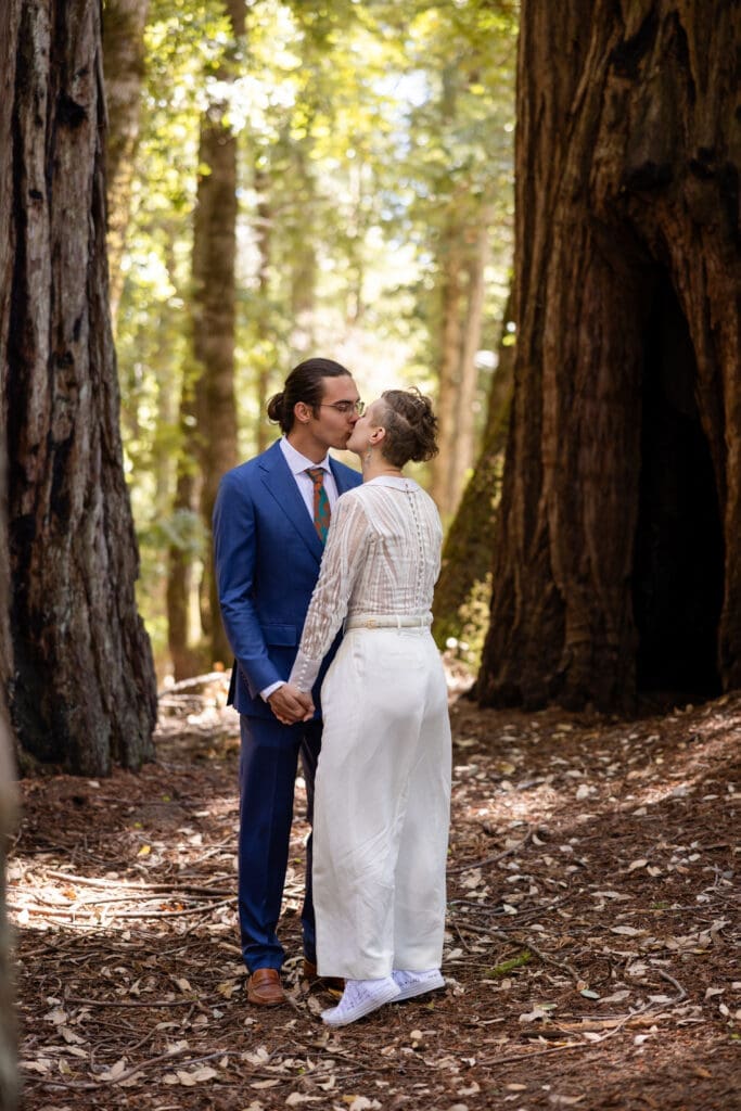 Couple sharing a first look inside a fairy ring of redwoods at Leonard Lake Reserve