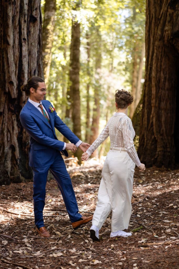 Couple sharing a first look inside a fairy ring of redwoods at Leonard Lake Reserve