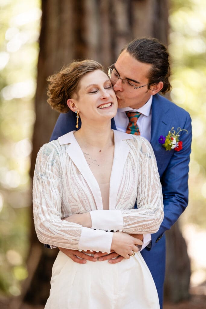 Couple takes windy wedding portraits in Mendocino Redwoods
