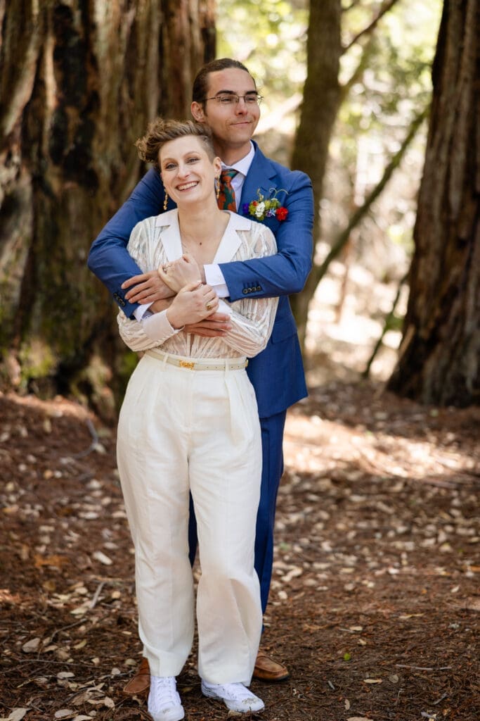 Couple takes windy wedding portraits in Mendocino Redwoods
