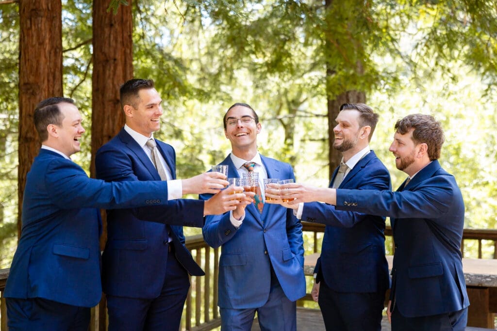 Groom cheers with groomsmen before Leonard Lake Reserve wedding