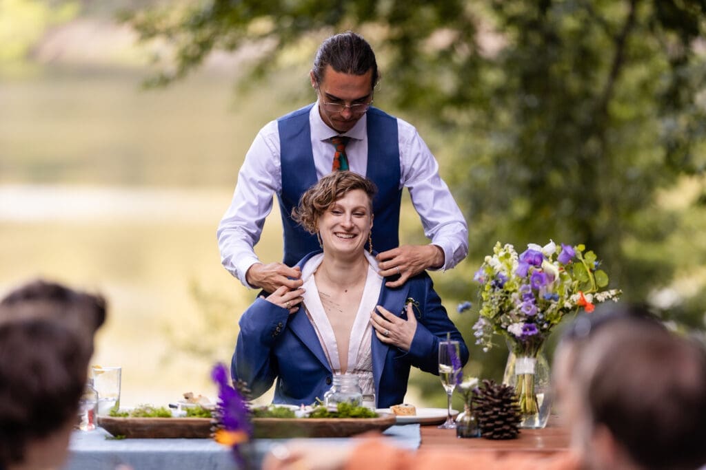 Outdoor wedding reception dinner overlooking Leonard Lake in the Mendocino redwoods