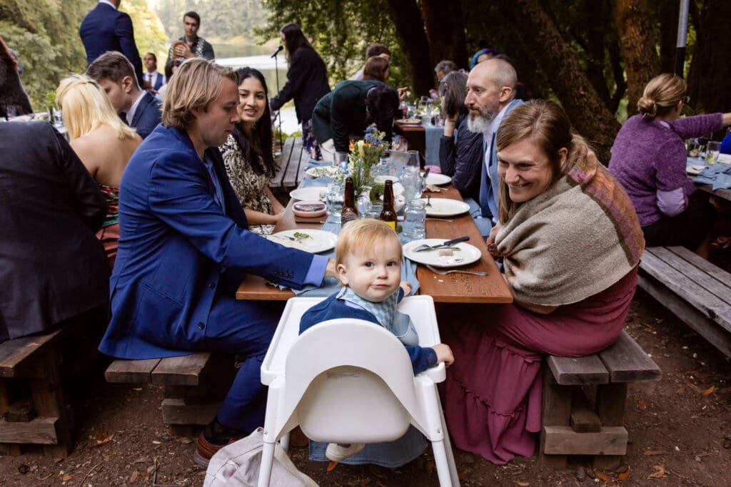 Outdoor wedding reception dinner overlooking Leonard Lake in the Mendocino redwoods