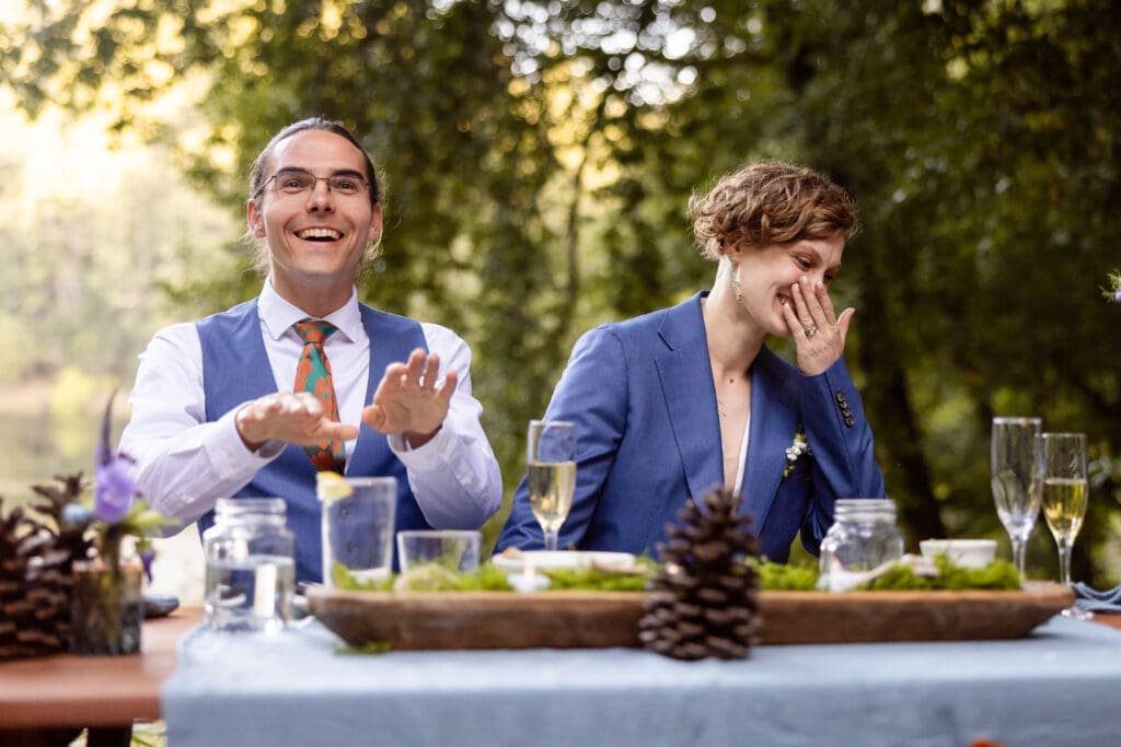 Outdoor wedding reception dinner overlooking Leonard Lake in the Mendocino redwoods