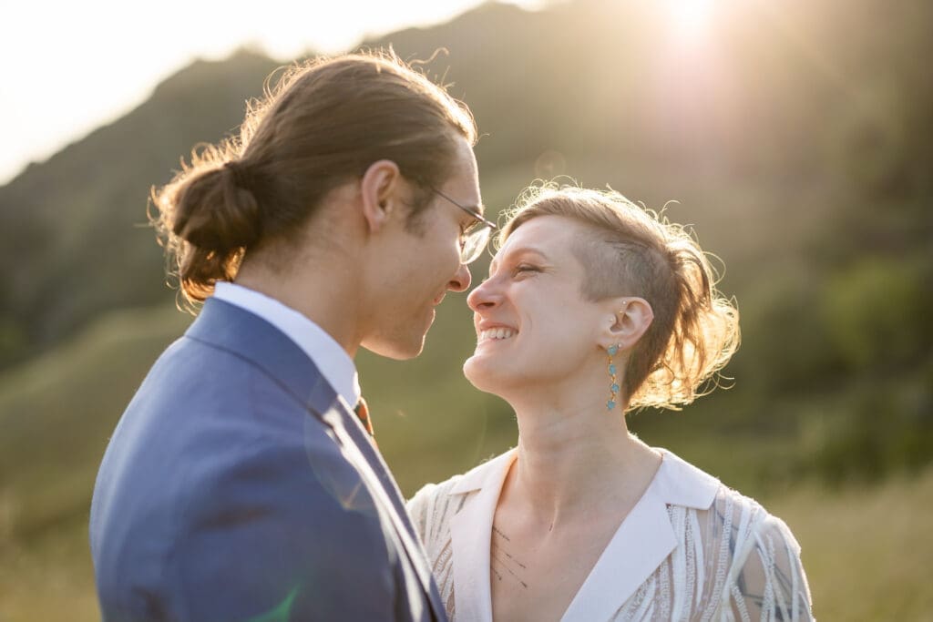 Bride and groom golden hour portraits in an open field at Leonard Lake Reserve