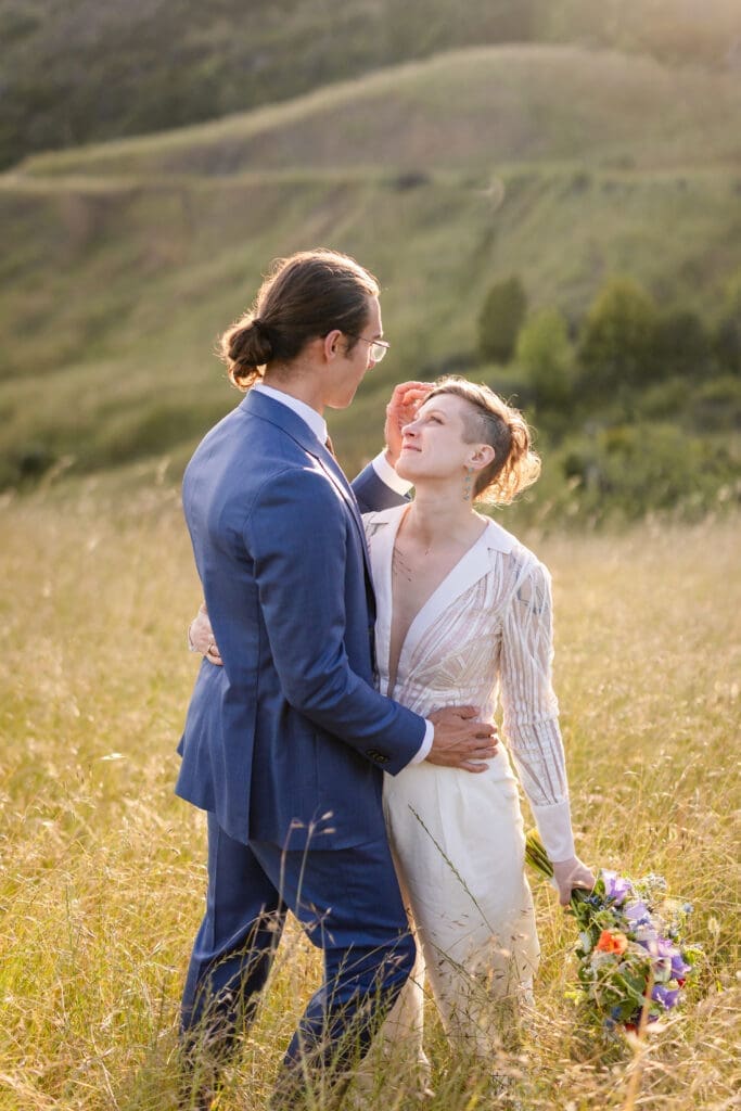 Bride and groom golden hour portraits in an open field at Leonard Lake Reserve