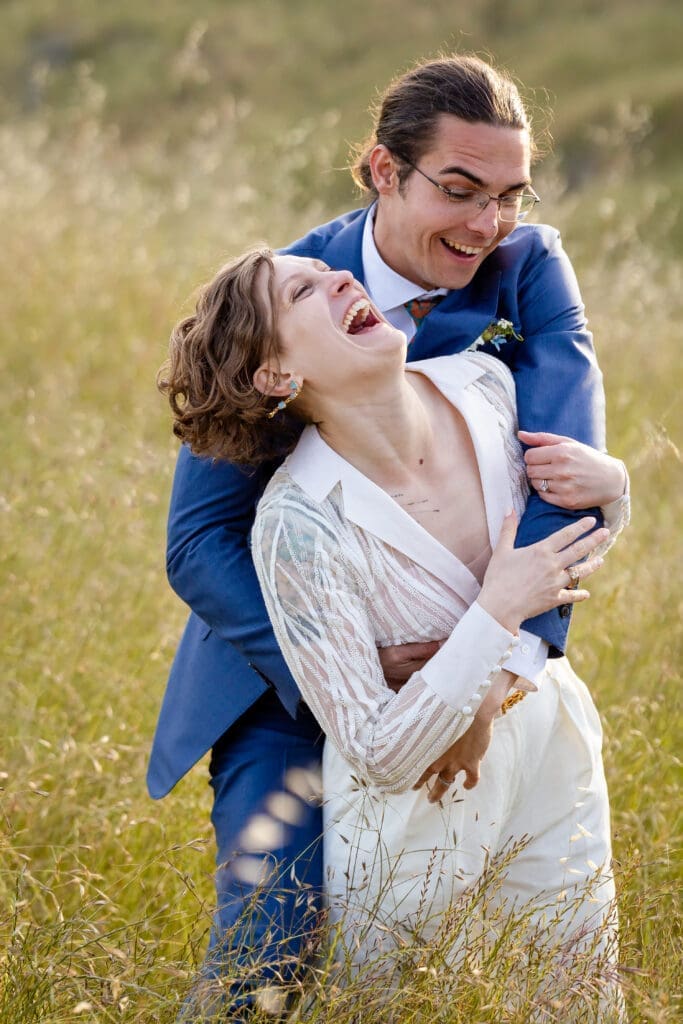 Bride and groom golden hour portraits in an open field at Leonard Lake Reserve