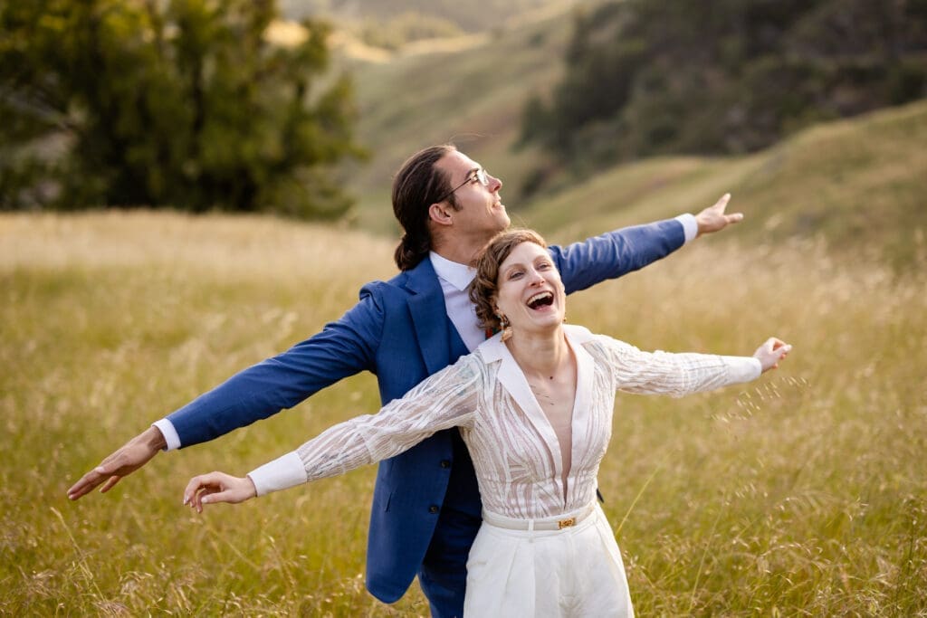 Bride and groom golden hour portraits in an open field at Leonard Lake Reserve