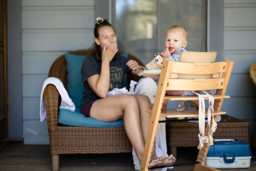 Wedding guests eat lunch on porch at Leonard Lake Reserve