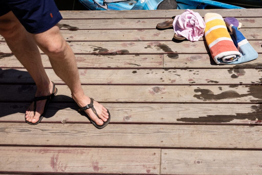 Wedding Guests sit on the dock at Leonard Lake Reserve, Mendocino