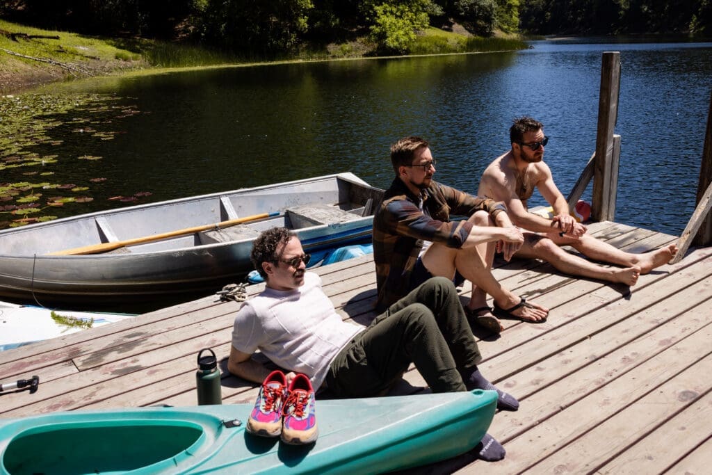 Wedding Guests sit on the dock at Leonard Lake Reserve, Mendocino