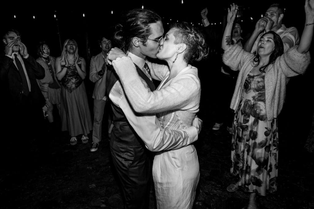 Bride and groom share a kiss on the dancefloor at their Leonard Lake Reserve Wedding.