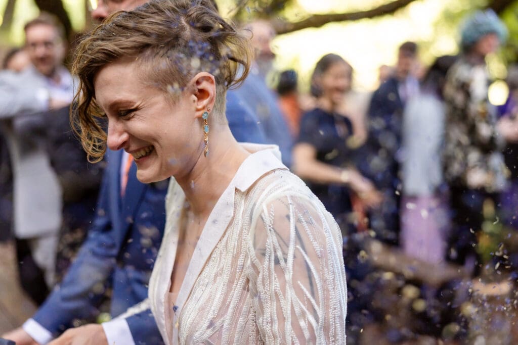 Guests tossing lavender as the couple exits their Leonard Lake Reserve wedding ceremony