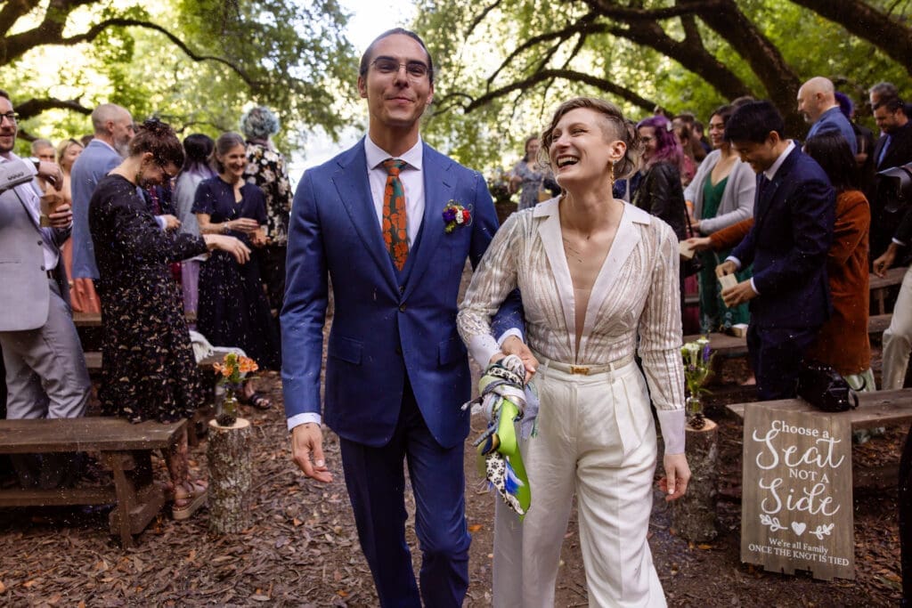 Guests tossing lavender as the couple exits their Leonard Lake Reserve wedding ceremony