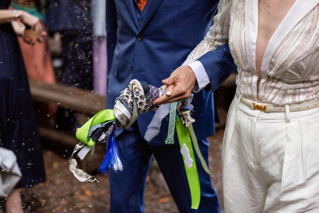 Guests tossing lavender as the couple exits their Leonard Lake Reserve wedding ceremony