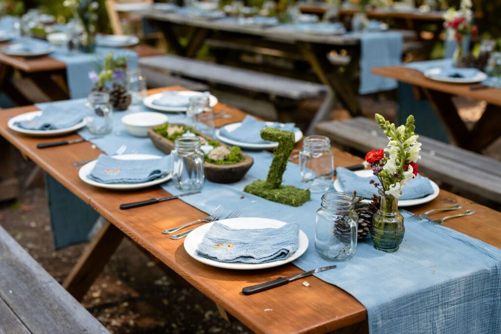Hand embroidered napkins at a DIY Mendocino County wedding reception table