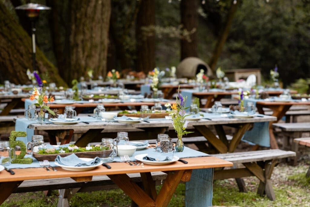 Hand embroidered napkins at a DIY Mendocino County wedding reception table